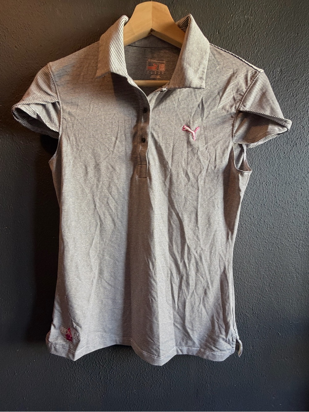 Puma women’s light Gray Polo with Pink Puma Logo